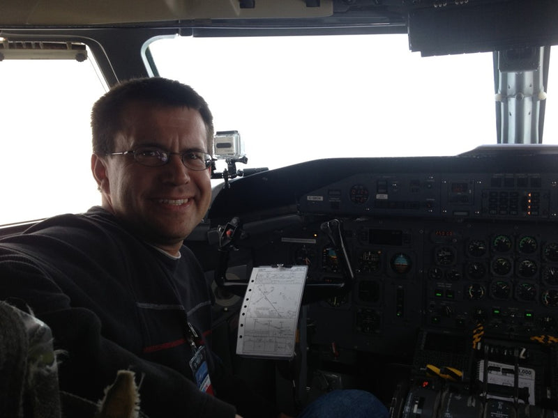 Photo of Grant Caswell in DHC-8 cockpit